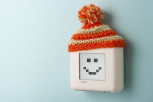 digital-thermostat-with-smiley-face-and-winter-hat